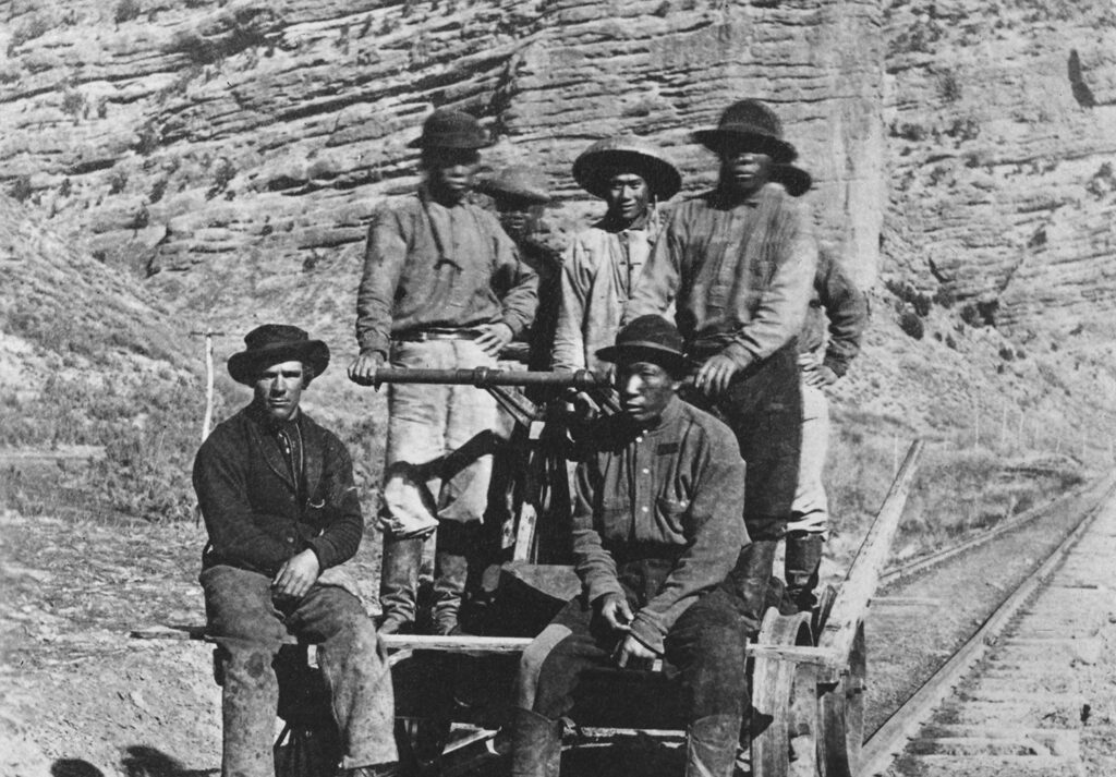 Railroad workers posing on a railroad handcar in the Sierra Nevada mountains, California, circa 1875. (Photo by Graphic House/Archive Photos/Getty Images)