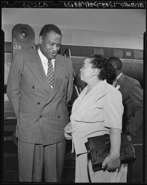 Actor, singer, and civil rights activist Paul Robeson (left) speaks with fellow activist and California Eagle editor and publisher Charlotta Bass. Both Robeson and Bass were accused of disloyalty by the Committee of Un-American Activities and were the subjects to federal investigations. Source: Los Angeles Daily News Negatives, 1925-1954.